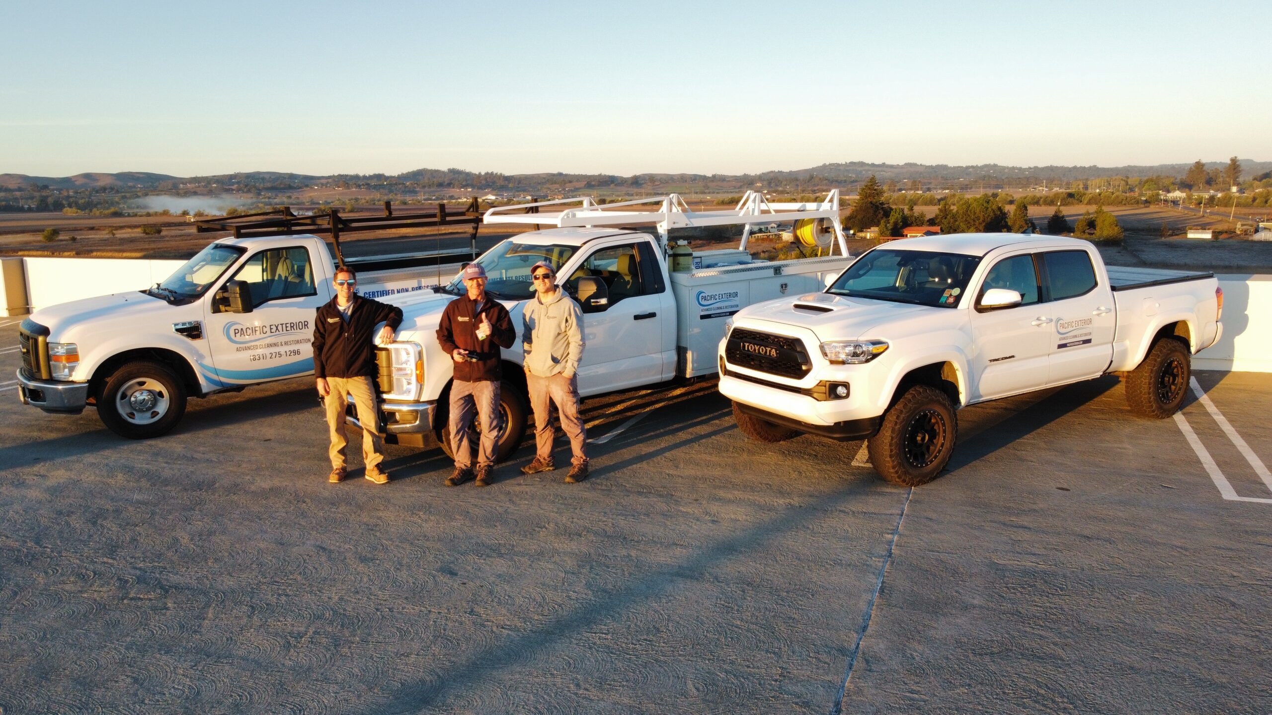 Pacific exterior employees standing near the vehicle