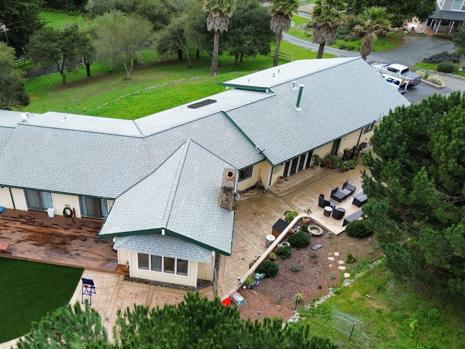 Large ranch home green trim roof