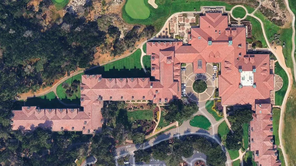 Aerial view of landmark peninsula hospitality property — 190,000 sq ft clay tile roof restoration — pacific exterior